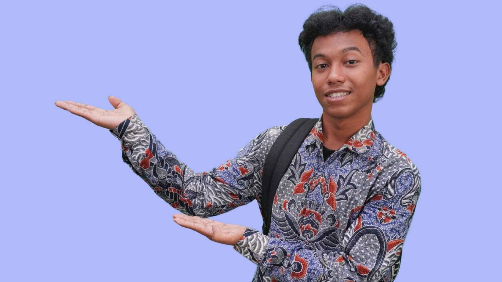 Youth hold ups his hands to show something