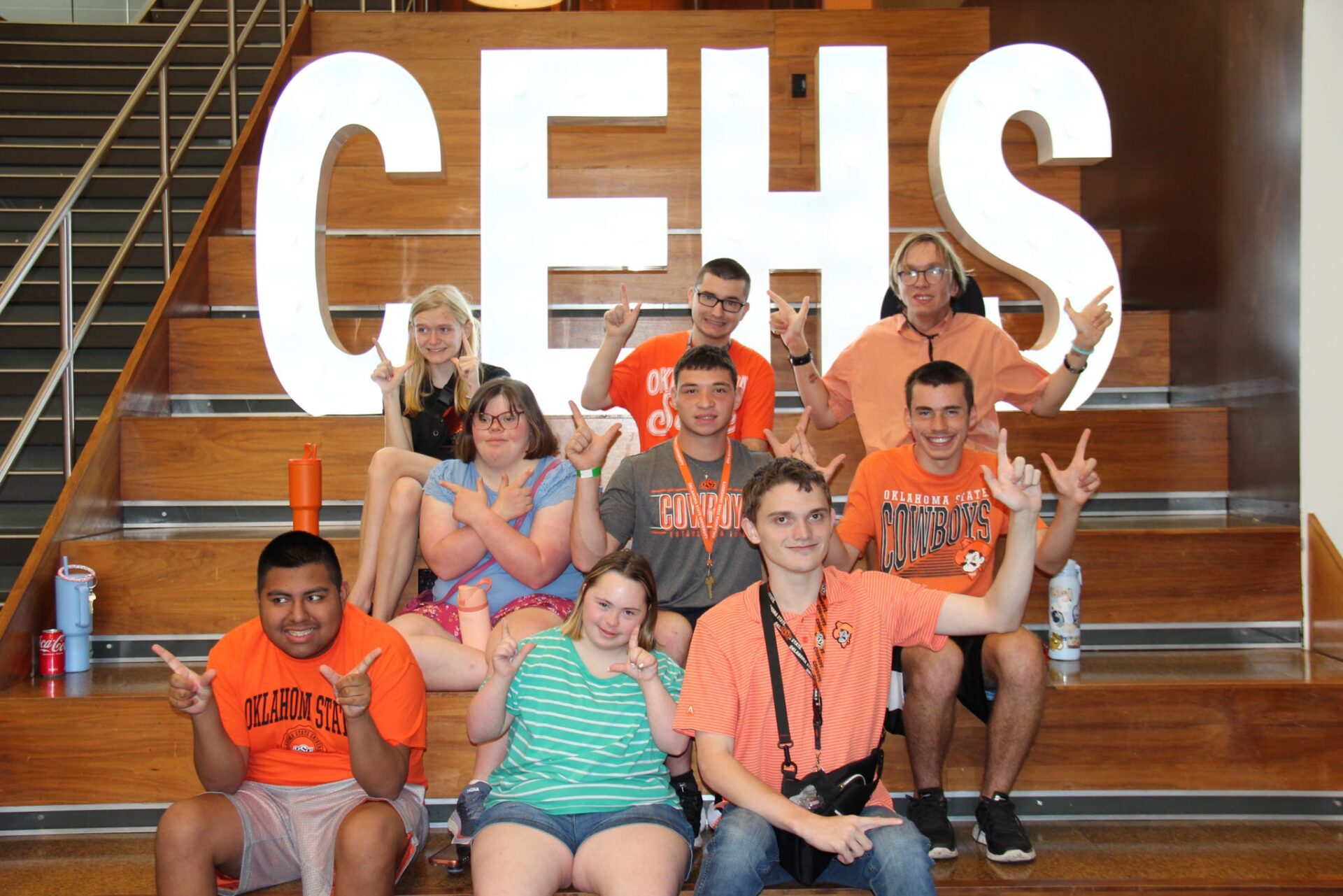 A group of opportunity orange students sitting in bleachers at OSU