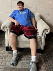 Young man sitting in a chair